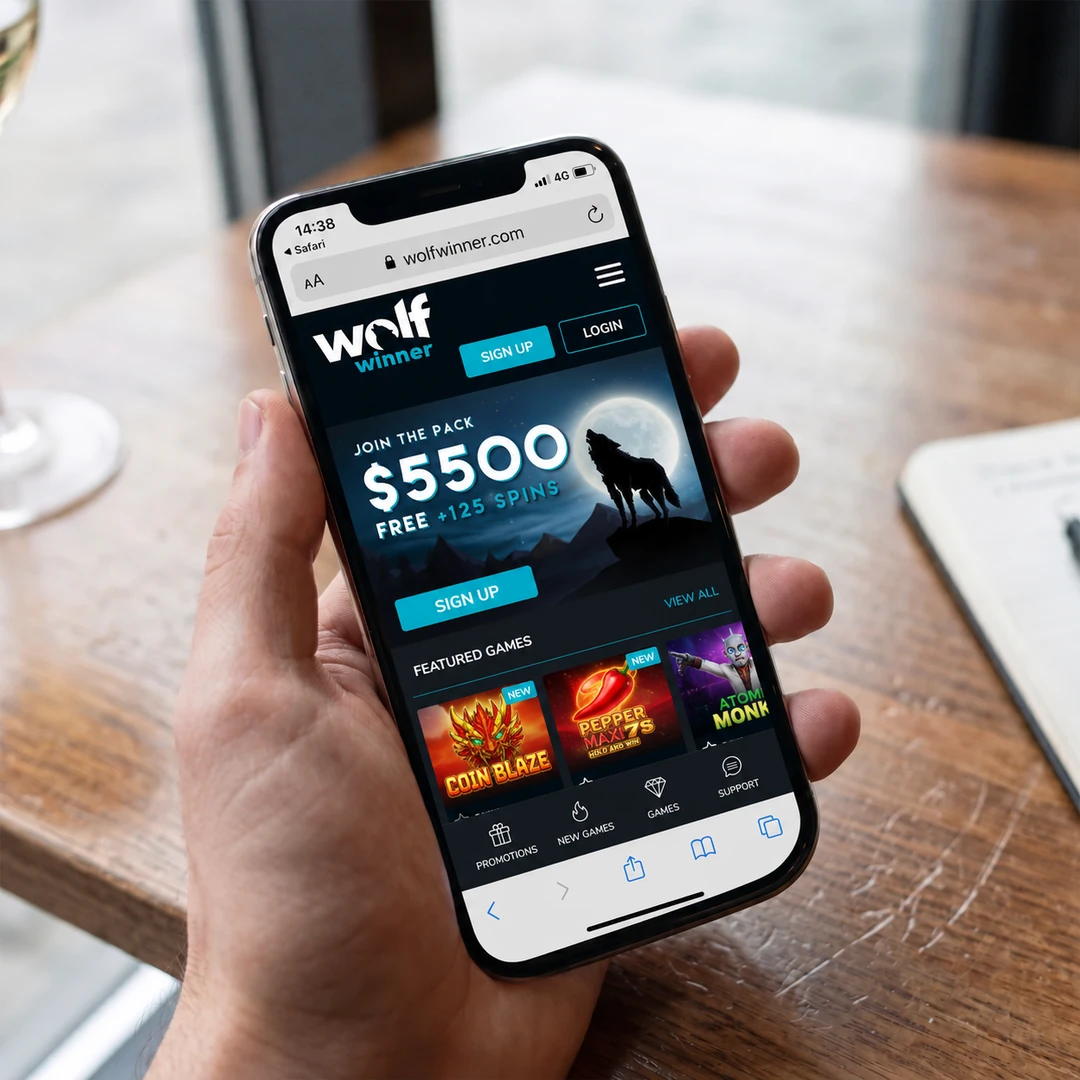 An iPhone 13 in hand running the Wolf Winner mobile casino in Safari over 4G, a pokie spinning in the browser; the status bar shows network and time.
